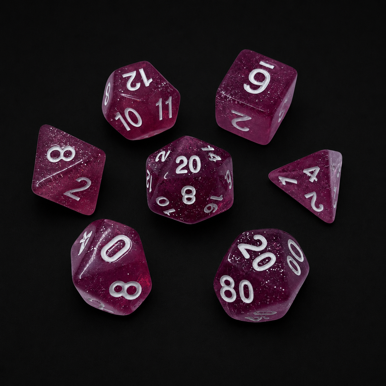 Set of purple polyhedral dice with white numbers on a black background