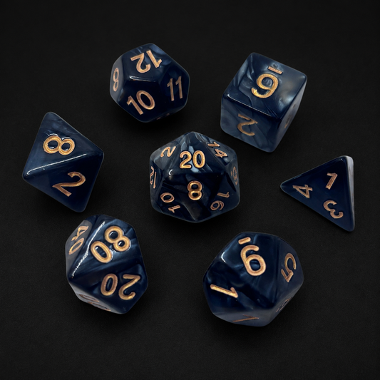 Set of blue polyhedral dice with gold numbers on a black background