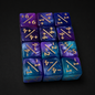 Set of blue and purple polyhedral dice with gold numbers on a black background