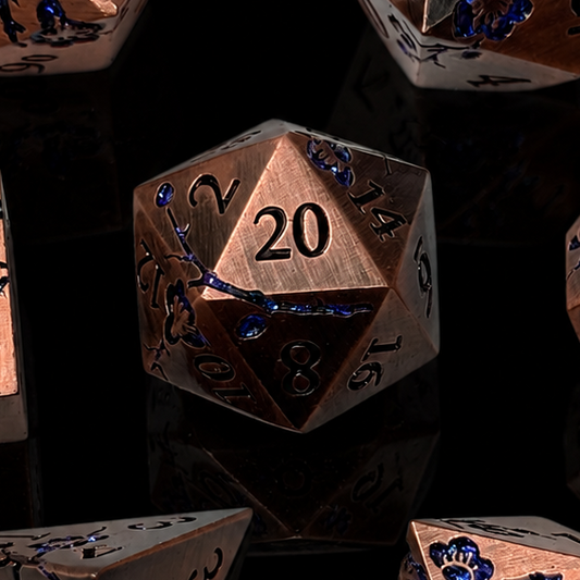 Set of metallic polyhedral dice on a black background